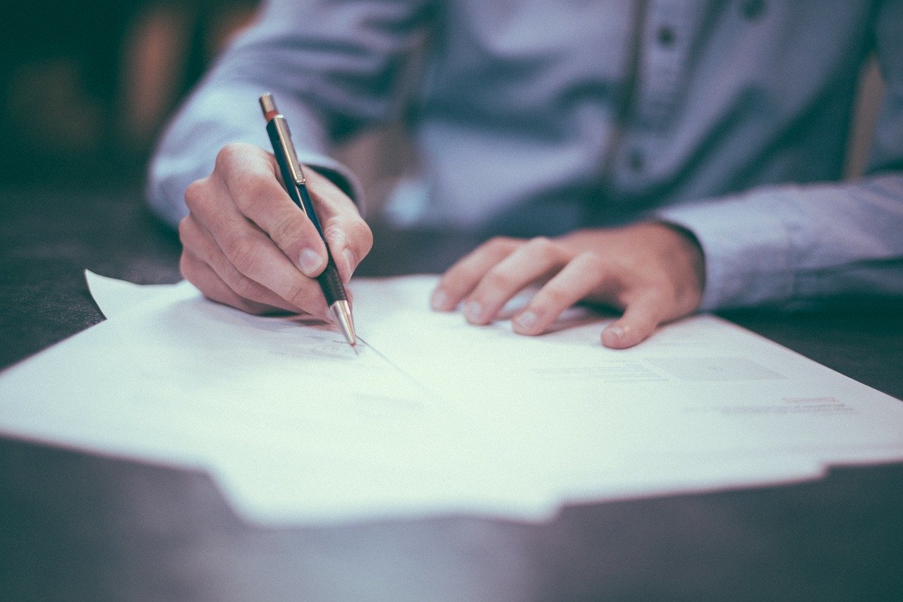 Man-Filling-Out-Hazardous-Waste-Manifest-Form