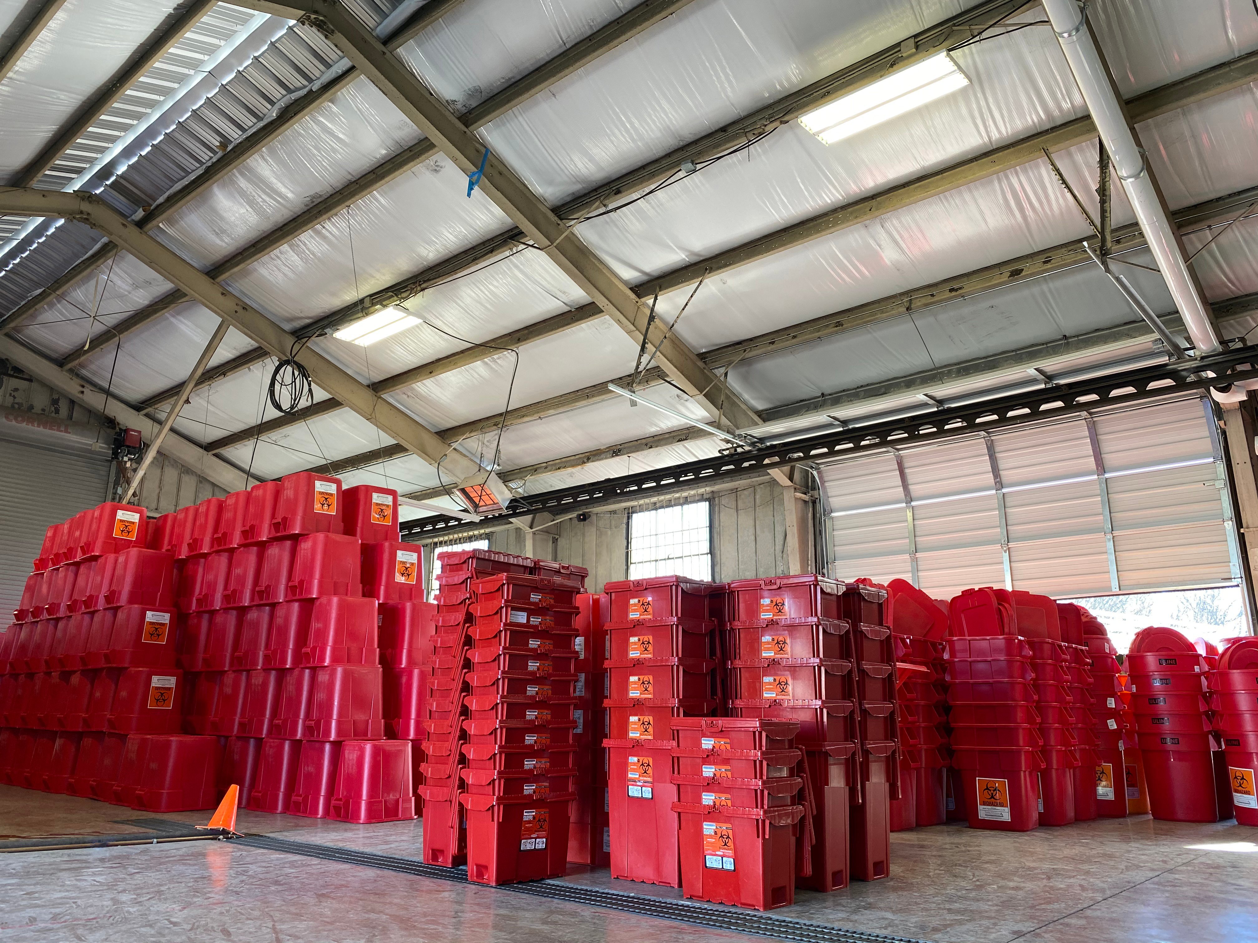 Medical waste containers in treatment facility